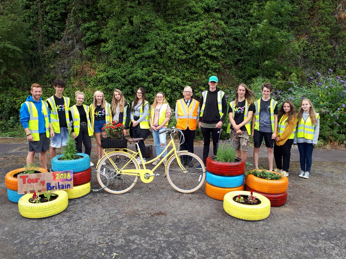 Petroc students with the upcycled planters and donated bicycle